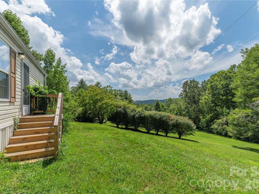 124 Sayles Town Place, Fairview, NC 28730.  MLS# CAR4415601, YatesRealty ID 45387. Nice topography