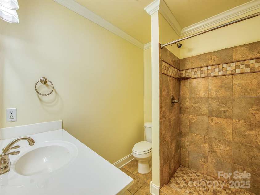 20A Lila Lane, Clyde, NC 28721.  MLS# CAR4258069, YatesRealty ID 454. Basement level bathroom