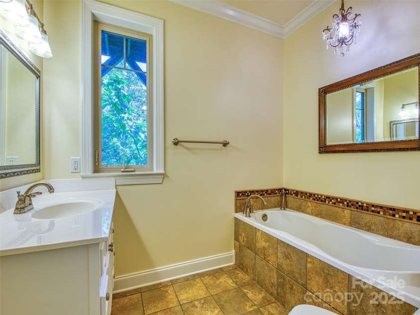 20A Lila Lane, Clyde, NC 28721.  MLS# CAR4258069, YatesRealty ID 454. Main level bathroom
