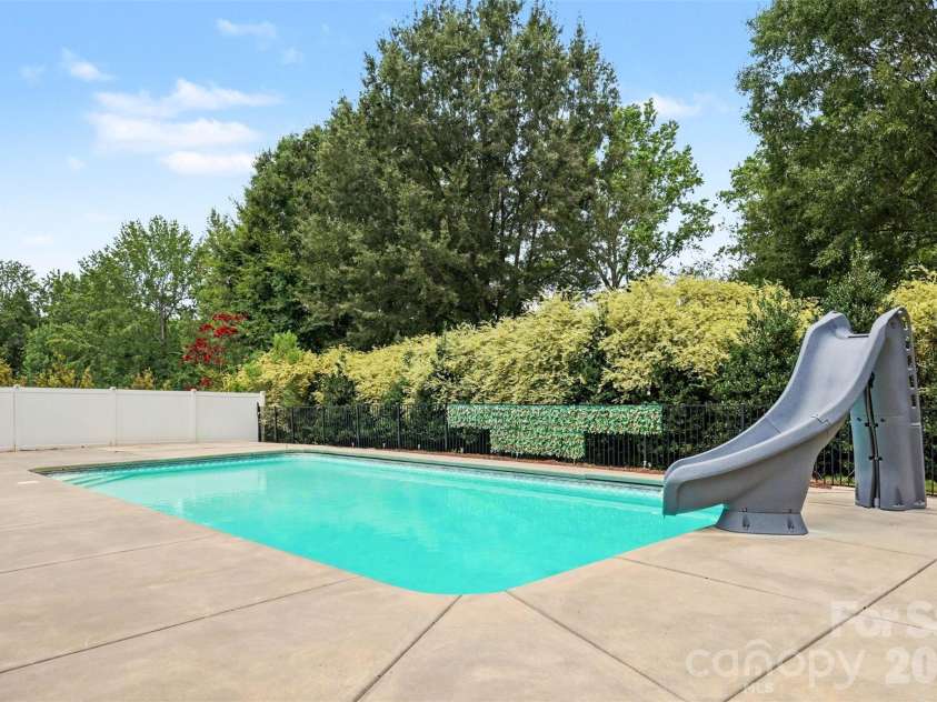 1799 Mill Creek Church Road, Monroe, NC 28110.  MLS# CAR4415878, YatesRealty ID 45403. 8' pool with a slide