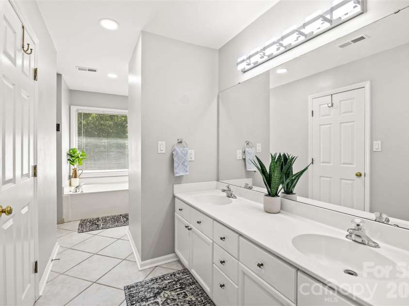 5933 Fitzwilliams Lane, Charlotte, NC 28270.  MLS# CAR4411055, YatesRealty ID 45409. Double vanity in primary bath.
