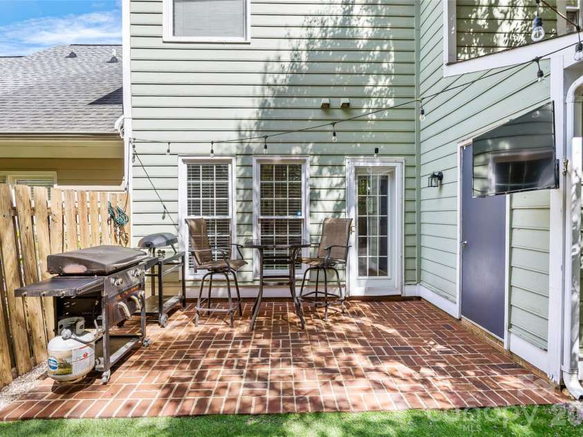 5933 Fitzwilliams Lane, Charlotte, NC 28270.  MLS# CAR4411055, YatesRealty ID 45409. Storage room access from patio.