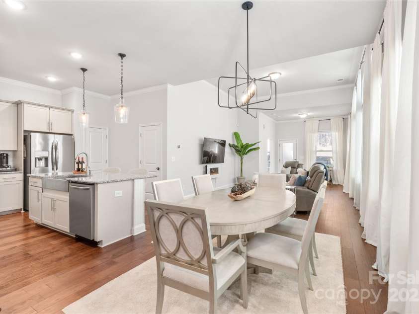 411 Belton Street, Charlotte, NC 28209.  MLS# CAR4321222, YatesRealty ID 4543. From cooking to dining...all connected! Open layout keeps everyone together and the conversation flowing.
