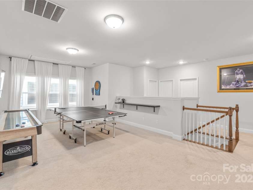 411 Belton Street, Charlotte, NC 28209.  MLS# CAR4321222, YatesRealty ID 4543. Perfect for family or guests! Three bedrooms surround the loft/rec room, offering space for everyone.