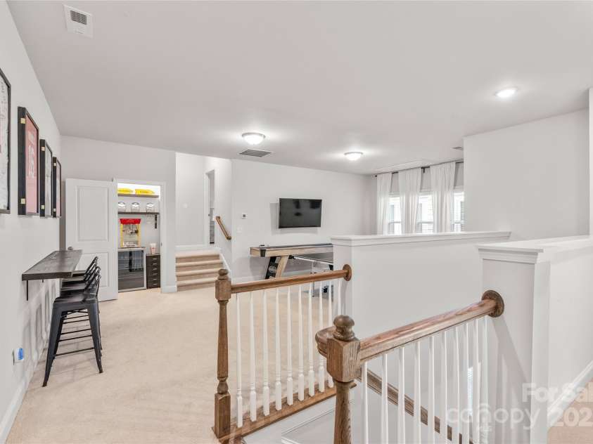 411 Belton Street, Charlotte, NC 28209.  MLS# CAR4321222, YatesRealty ID 4543. Spacious loft/rec room offers a versatile second living area..perfect for a game room, media space, or hangout.