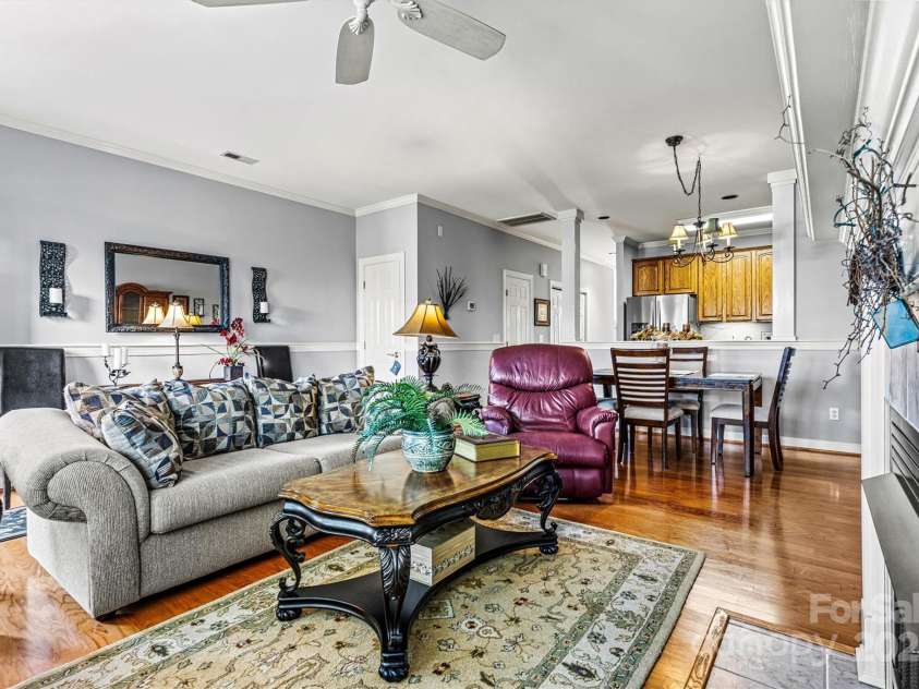5472 Ives Street, Concord, NC 28027.  MLS# CAR4223676, YatesRealty ID 4543. Living room looking over dining area