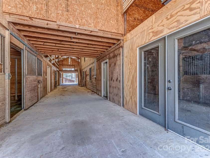 674 Walnut Ridge Road, Brevard, NC 28712.  MLS# CAR4235374, YatesRealty ID 4544. Barn - Main Level - Stalls
