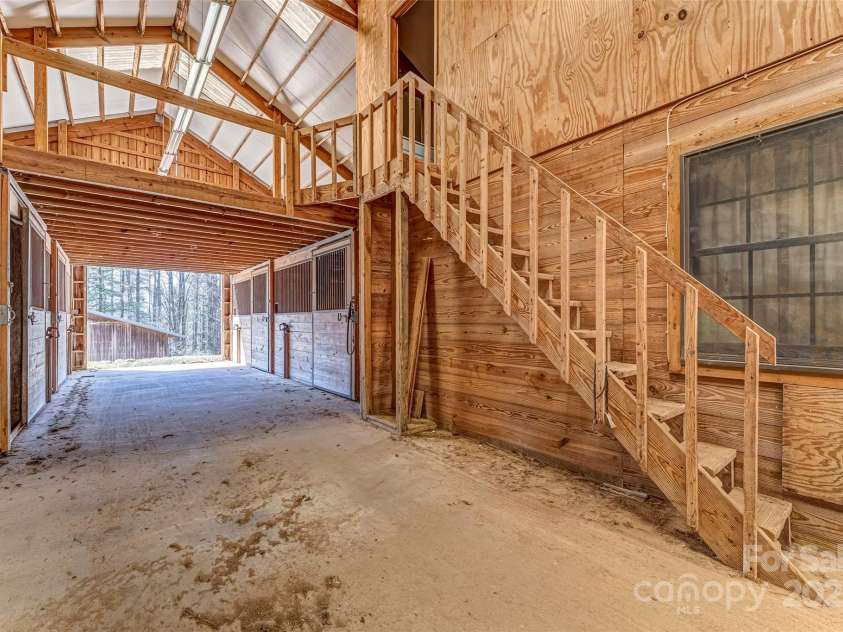 674 Walnut Ridge Road, Brevard, NC 28712.  MLS# CAR4235374, YatesRealty ID 4544. Barn - Main Level - Stalls
