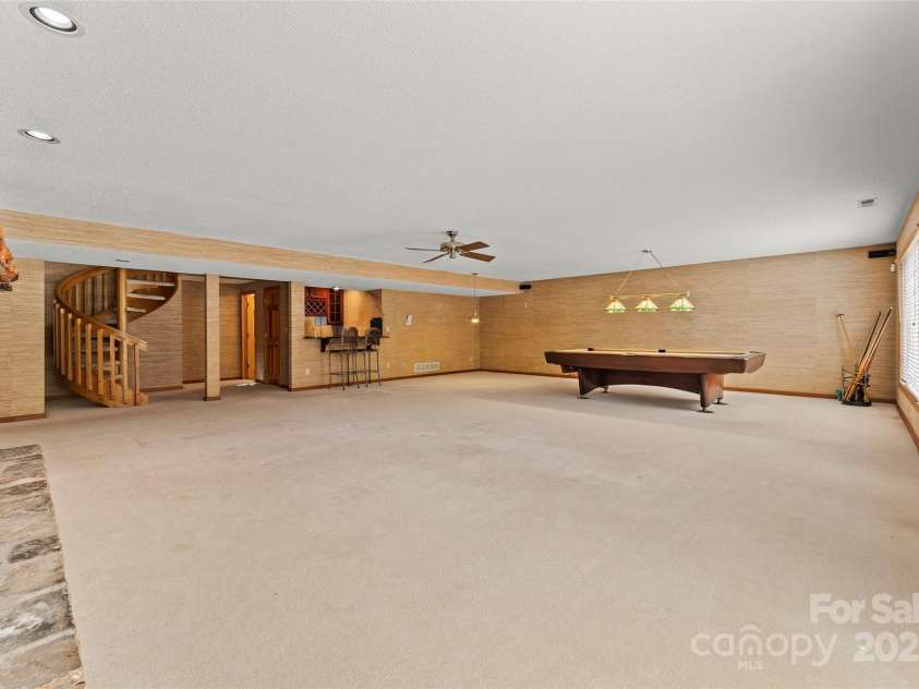 674 Walnut Ridge Road, Brevard, NC 28712.  MLS# CAR4235374, YatesRealty ID 4544. Main House - Basement Level - Family Room