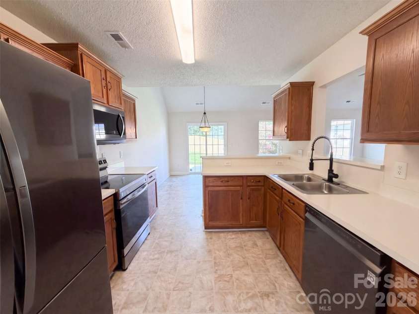 9244 Simonton Drive, Charlotte, NC 28269.  MLS# CAR4416486, YatesRealty ID 45443. Staged Photo