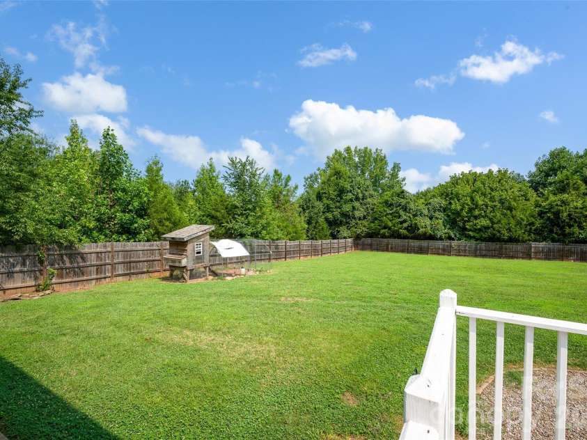 10724 Kingsview Drive, Davidson, NC 28036.  MLS# CAR4409874, YatesRealty ID 45444. Bring your chickens! Coop in place.