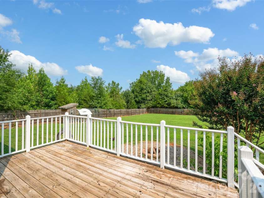 10724 Kingsview Drive, Davidson, NC 28036.  MLS# CAR4409874, YatesRealty ID 45444. Deck space overlooking large, flat backyard.