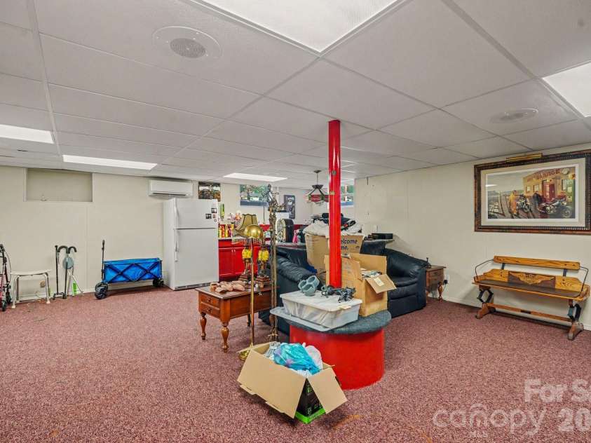 103 Dale Avenue, Kannapolis, NC 28081.  MLS# CAR4416135, YatesRealty ID 45445. Basement finished area has kitchen, kitchen island and a mini-split HVAC. Includes a fireplace and built in cabinets .