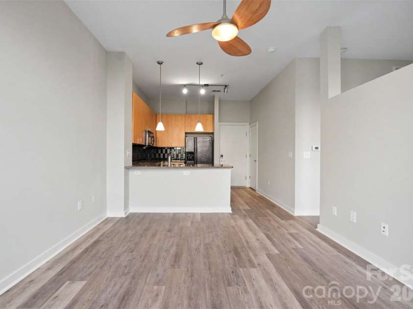 525 6th Street, Charlotte, NC 28202.  MLS# CAR4416190, YatesRealty ID 45446. Living Room & Kitchen