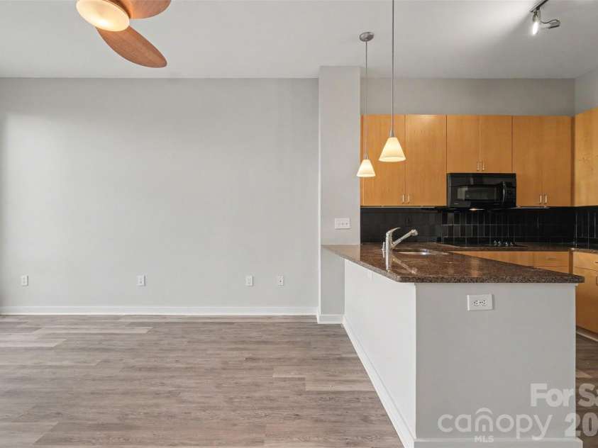 525 6th Street, Charlotte, NC 28202.  MLS# CAR4416190, YatesRealty ID 45446. Living Room & Kitchen