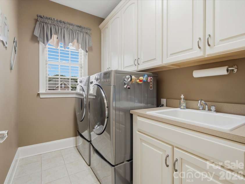 1023 Madras Court, Davidson, NC 28036.  MLS# CAR4415353, YatesRealty ID 45469. Laundry