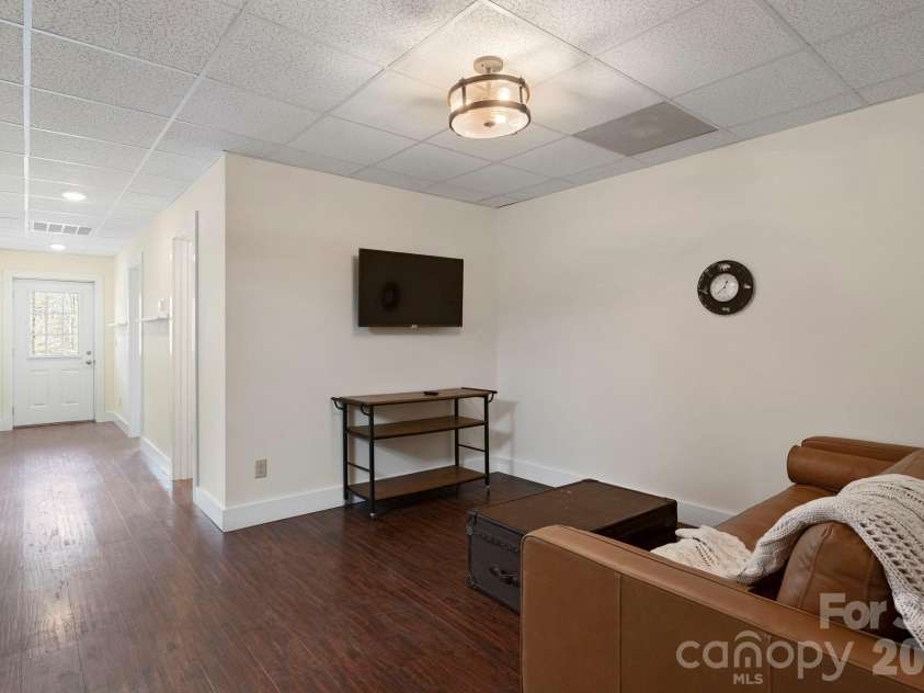 19 Frontier Court, Asheville, NC 28805.  MLS# CAR4254275, YatesRealty ID 4547. Lower Level Living Room
