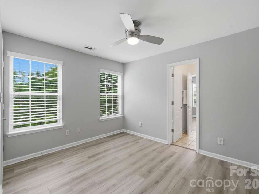 1001 Yellow Daisy Drive, Matthews, NC 28104.  MLS# CAR4415570, YatesRealty ID 45480. A functional bedroom layout provides privacy while sharing a connecting full bathroom.