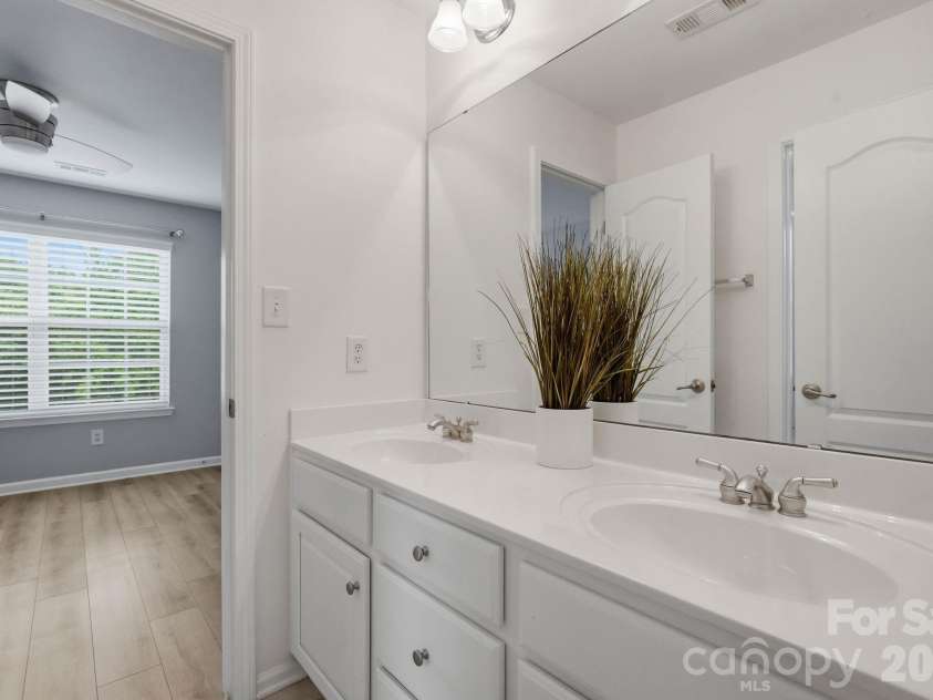 1001 Yellow Daisy Drive, Matthews, NC 28104.  MLS# CAR4415570, YatesRealty ID 45480. Jack-and-Jill bathroom provides a practical connection between the two bedrooms.