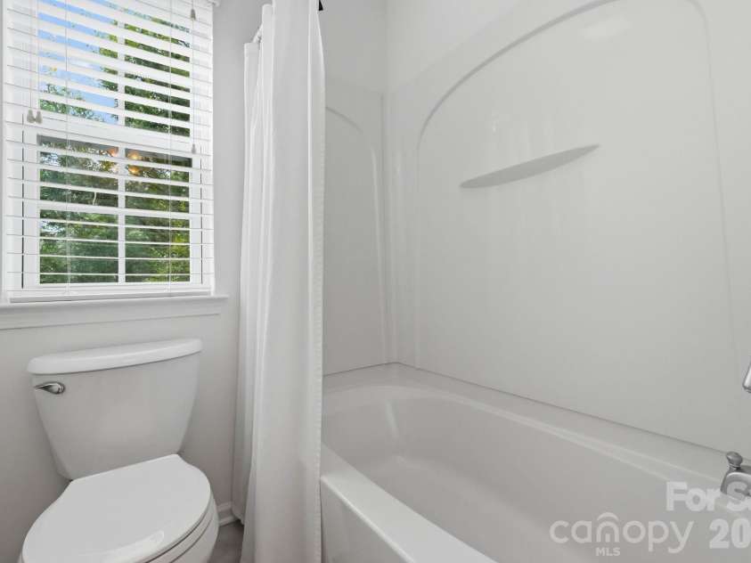 1001 Yellow Daisy Drive, Matthews, NC 28104.  MLS# CAR4415570, YatesRealty ID 45480. Jack-and-Jill bathroom provides a practical connection between the two bedrooms.