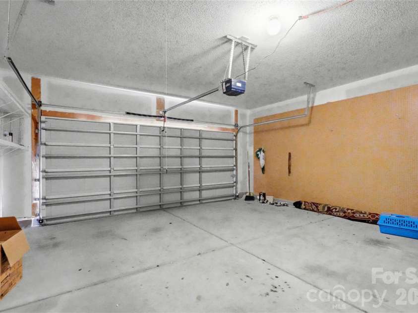 305 Annaberg Lane, Monroe, NC 28110.  MLS# CAR4414595, YatesRealty ID 45483. Attached 2-car garage with built-in pegboard storage and room for your workshop
