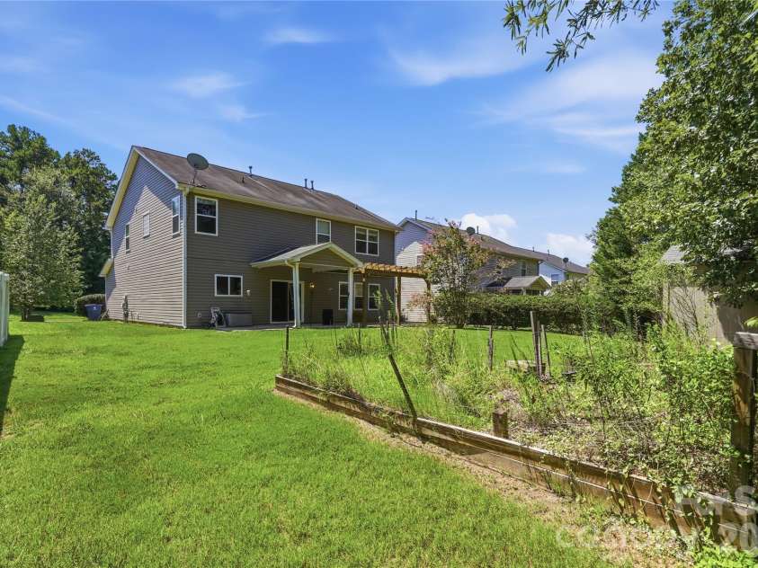 305 Annaberg Lane, Monroe, NC 28110.  MLS# CAR4414595, YatesRealty ID 45483. Fenced, hedge-lined backyard with true privacy, the feature that made the current owner fall in love with this St. John's Forest home