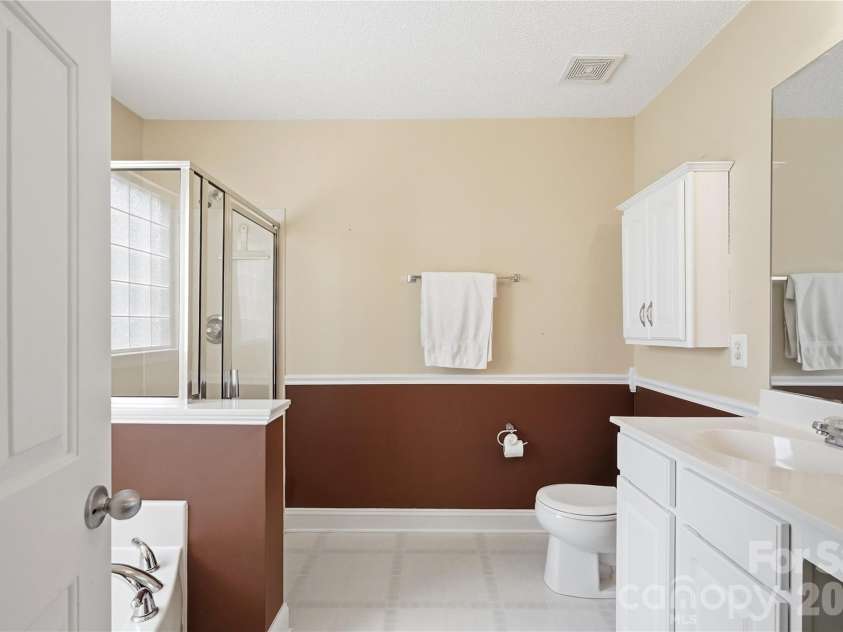 305 Annaberg Lane, Monroe, NC 28110.  MLS# CAR4414595, YatesRealty ID 45483. Primary bath featuring a relaxing garden tub and separate shower