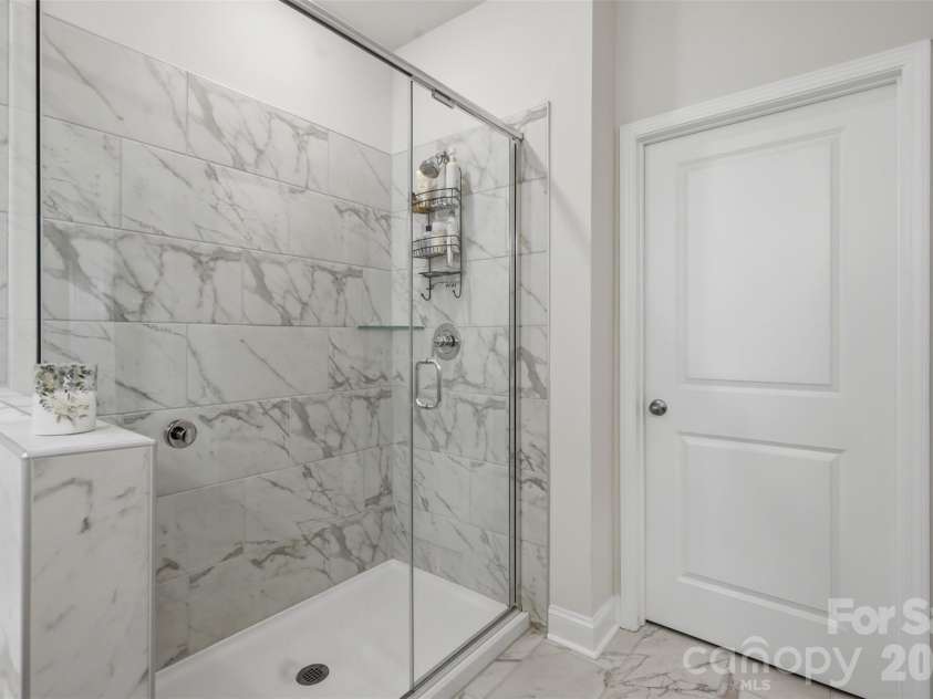 109 Noah Lane, Troutman, NC 28166.  MLS# CAR4414438, YatesRealty ID 45487. Large walk-in tile shower