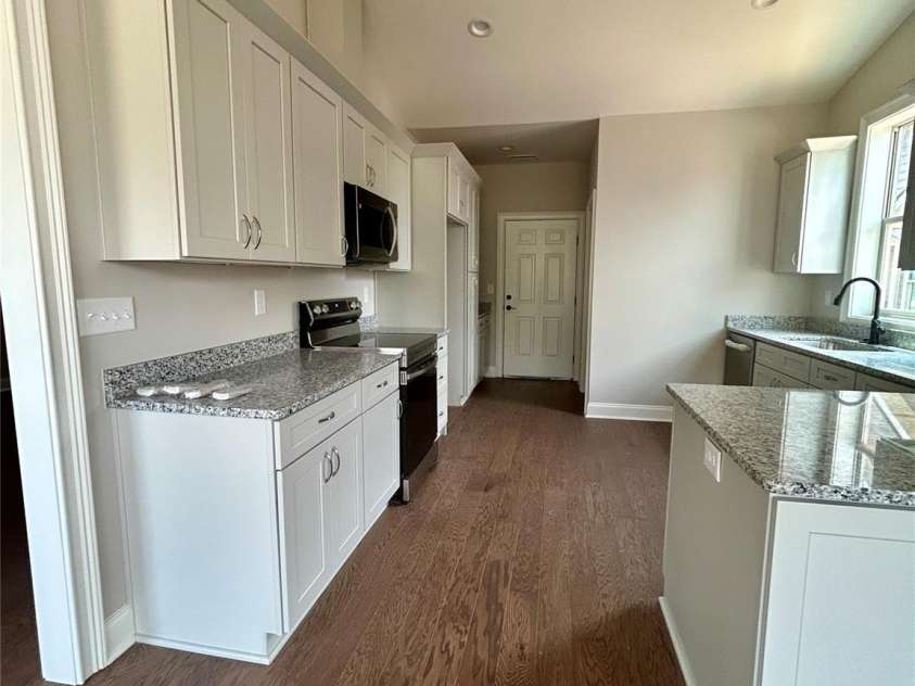 831-A Wynnshire Drive, Hickory, NC 28601.  MLS# CAR4413964, YatesRealty ID 45497. Kitchen with exit to garage. Utility room for washer and dryer.