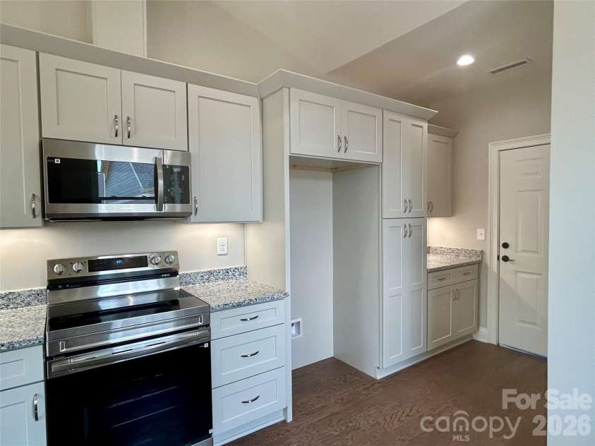 831-A Wynnshire Drive, Hickory, NC 28601.  MLS# CAR4413964, YatesRealty ID 45497. Space for refrigerator, door to garage.  Granite counters.