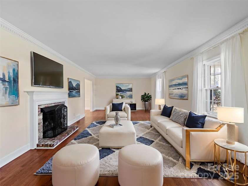 2111 Sagamore Road, Charlotte, NC 28209.  MLS# CAR4323130, YatesRealty ID 455. Living room with newly refinished hardwood floors and gas fireplace!