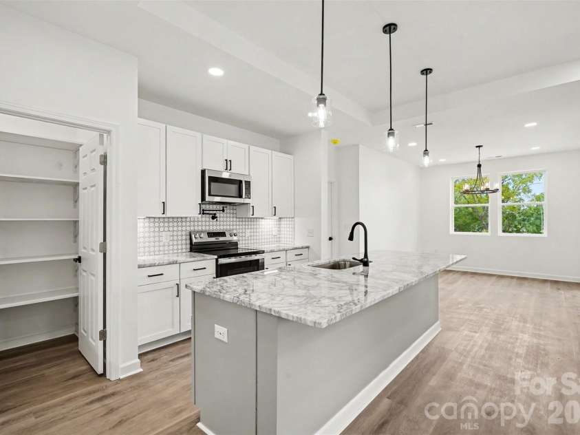 2416 Waxhaw Indian Trail Road, Indian Trail, NC 28079.  MLS# CAR4409507, YatesRealty ID 45502. Kitchen into Dining room