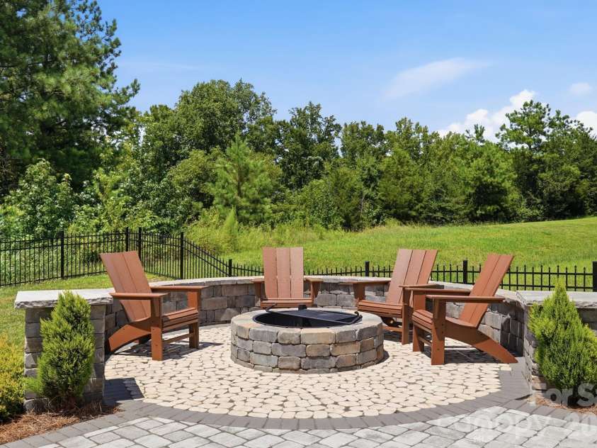 4492 Falls Lake Drive, Concord, NC 28025.  MLS# CAR4413181, YatesRealty ID 45507. Firepit with gril.