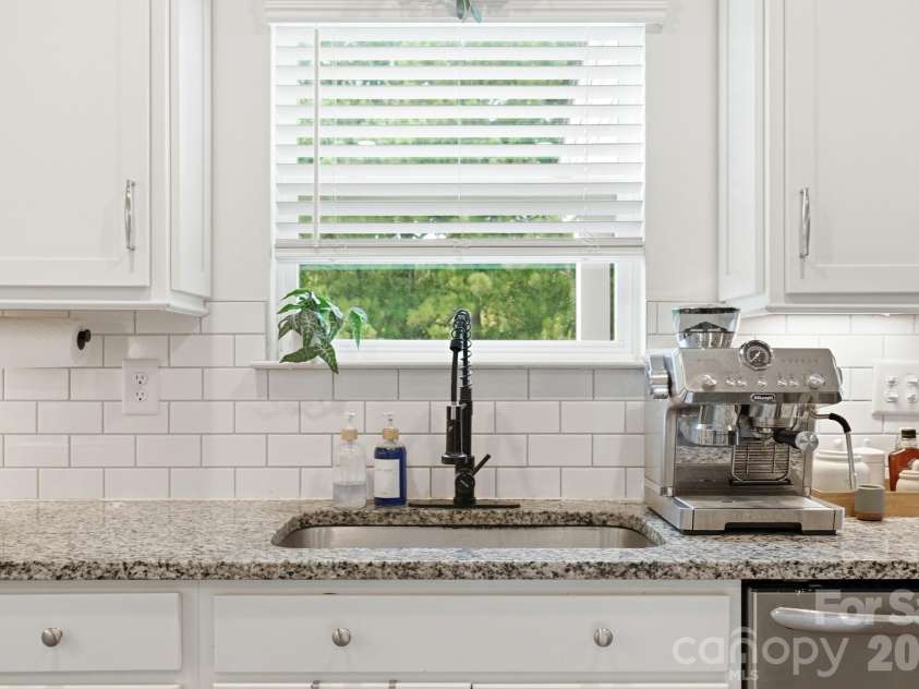 4492 Falls Lake Drive, Concord, NC 28025.  MLS# CAR4413181, YatesRealty ID 45507. Kitchen tile backsplash.