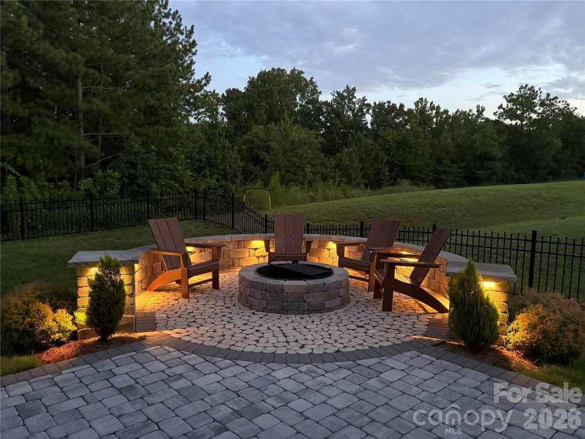 4492 Falls Lake Drive, Concord, NC 28025.  MLS# CAR4413181, YatesRealty ID 45507. Night View with the lights!