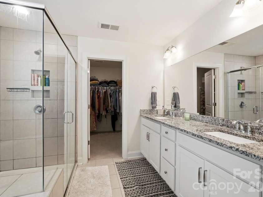 4492 Falls Lake Drive, Concord, NC 28025.  MLS# CAR4413181, YatesRealty ID 45507. Primary Bath with 2 sinks and granite counter tops!
