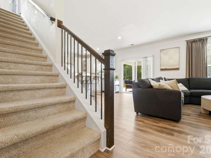 4492 Falls Lake Drive, Concord, NC 28025.  MLS# CAR4413181, YatesRealty ID 45507. Stairs with rod iron railing.