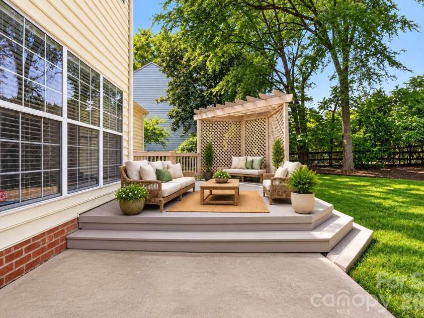 5936 Downfield Wood Drive, Charlotte, NC 28269.  MLS# CAR4413592, YatesRealty ID 45510. Tiered Deck with Pergola & Backyard Views – Virtually Staged