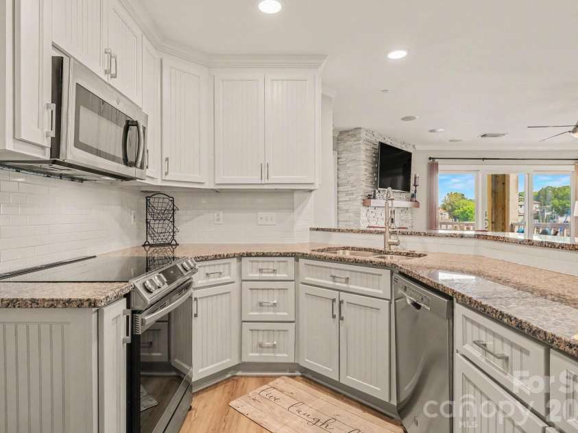 18613 Vineyard Point Lane, Cornelius, NC 28031.  MLS# CAR4409285, YatesRealty ID 45514. Ample cabinet space overlook open floorsplan