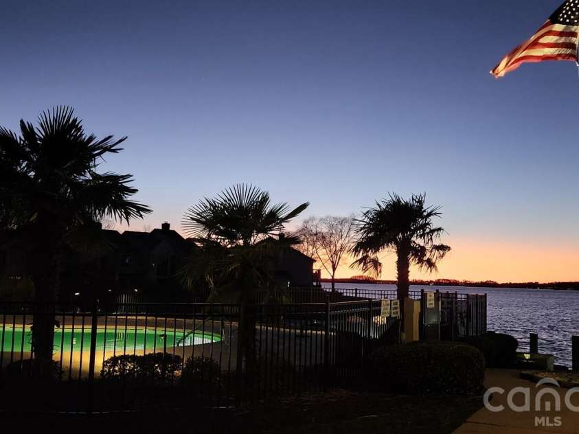 18613 Vineyard Point Lane, Cornelius, NC 28031.  MLS# CAR4409285, YatesRealty ID 45514. Community Pool Night Views