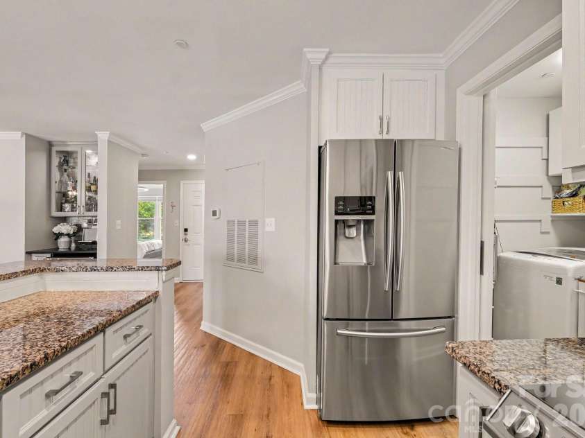 18613 Vineyard Point Lane, Cornelius, NC 28031.  MLS# CAR4409285, YatesRealty ID 45514. Large Kitchen with Stainless Steel Appliances and laundry room with ample storage space