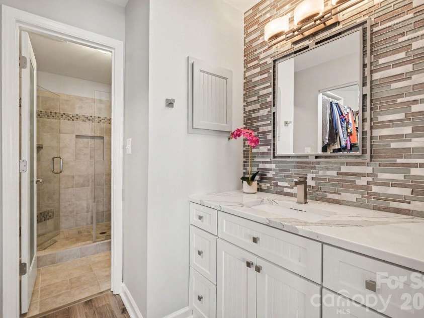 18613 Vineyard Point Lane, Cornelius, NC 28031.  MLS# CAR4409285, YatesRealty ID 45514. Updated Primary Bathroom features a large walk-in closet