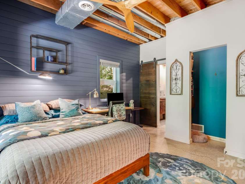 2752 Gerton Highway, Gerton, NC 28735.  MLS# CAR4409357, YatesRealty ID 45515. Additional terrace-level bedroom with exposed beams and distinctive architectural details offering its own connection to the outdoors