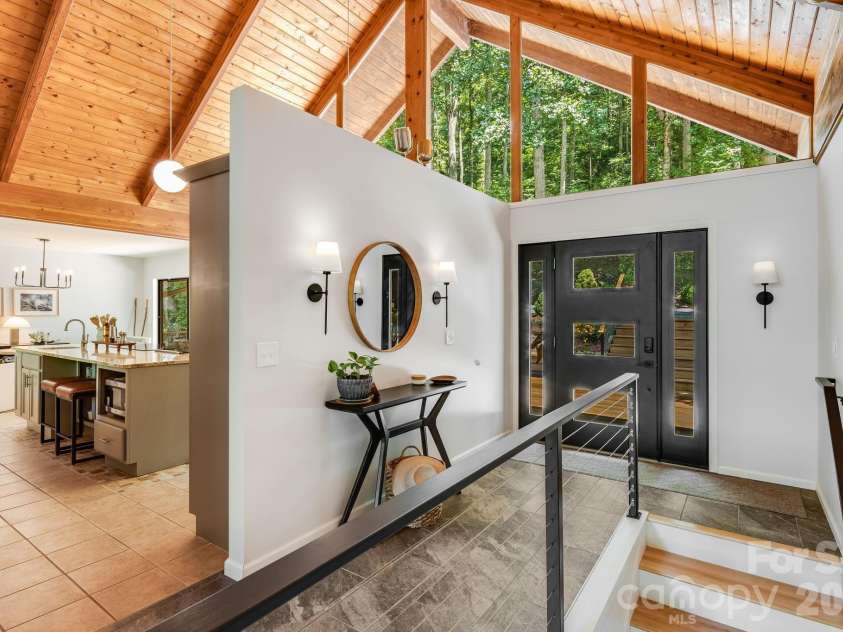 2752 Gerton Highway, Gerton, NC 28735.  MLS# CAR4409357, YatesRealty ID 45515. Dramatic entry introduces the home's soaring wood ceilings and architectural character