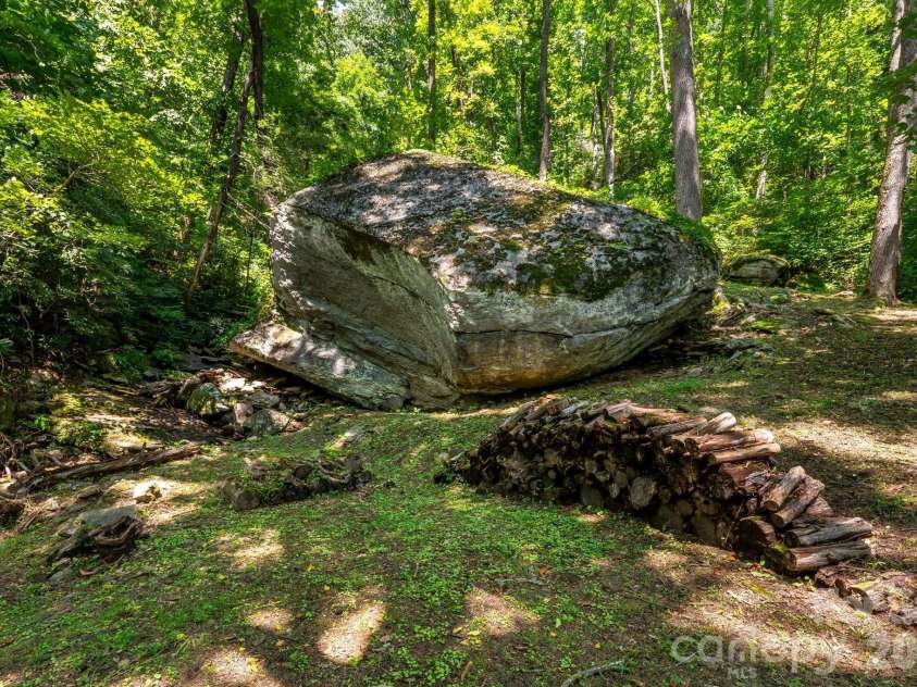 2752 Gerton Highway, Gerton, NC 28735.  MLS# CAR4409357, YatesRealty ID 45515. Impressive boulder formations create a distinctive mountain setting
