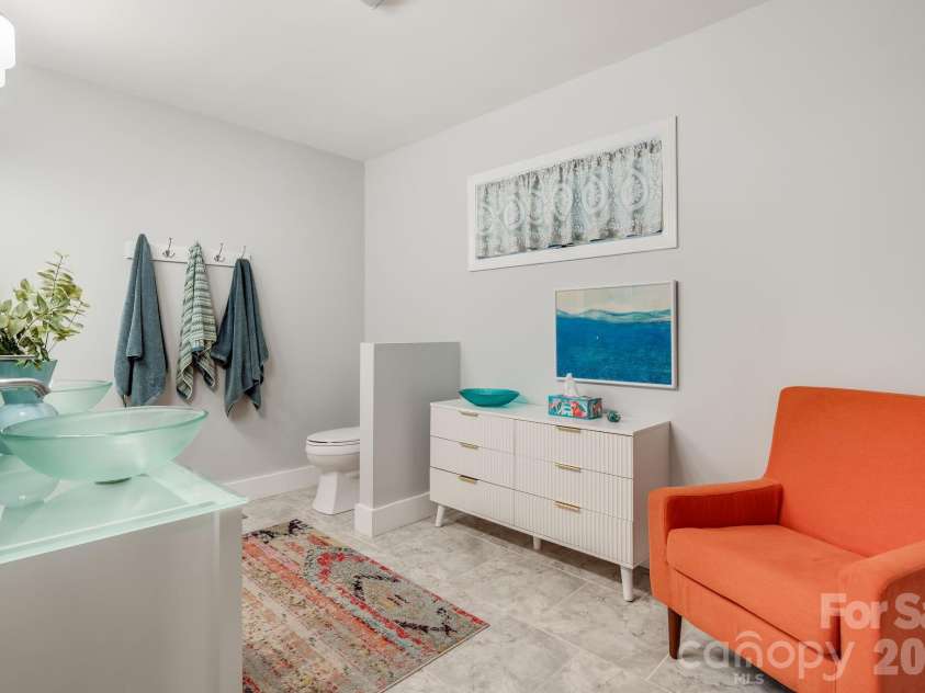 2752 Gerton Highway, Gerton, NC 28735.  MLS# CAR4409357, YatesRealty ID 45515. Light-filled ensuite primary bath with generous space and distinctive finishes