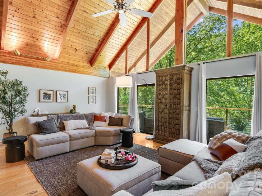 2752 Gerton Highway, Gerton, NC 28735.  MLS# CAR4409357, YatesRealty ID 45515. Main-level great room with direct walkout access to the elevated upper deck