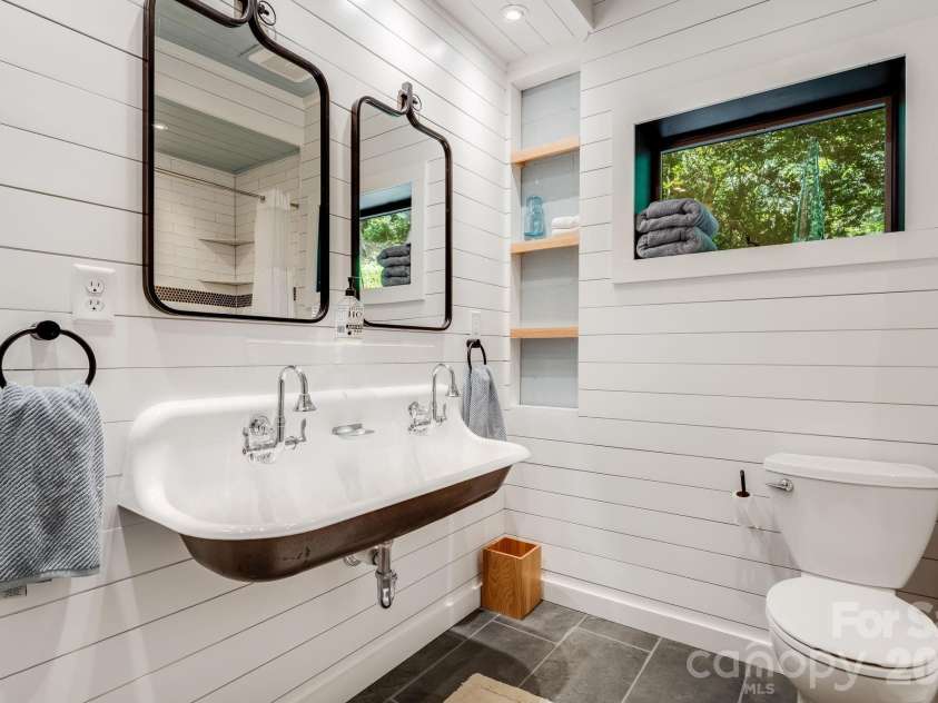 2752 Gerton Highway, Gerton, NC 28735.  MLS# CAR4409357, YatesRealty ID 45515. Terrace-level bath with walk-in shower