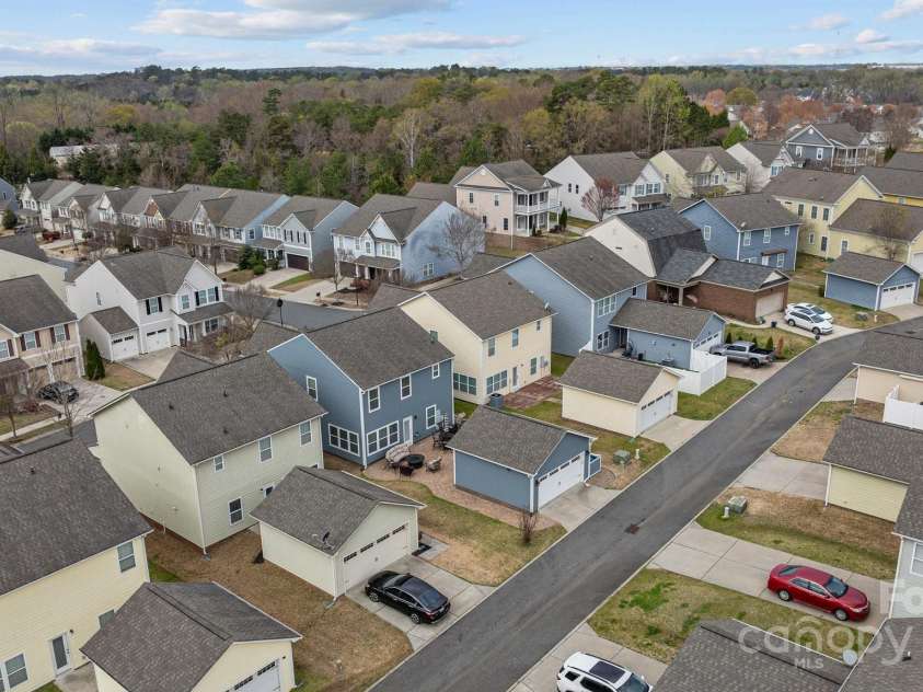 12545 Druids Glen Drive, Pineville, NC 28134.  MLS# CAR4234518, YatesRealty ID 4552. Detached garage empties into an alley behind homes