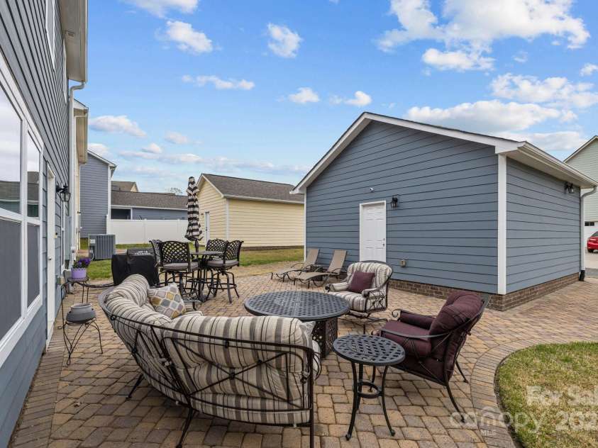 12545 Druids Glen Drive, Pineville, NC 28134.  MLS# CAR4234518, YatesRealty ID 4552. Enjoy the breeze on your brick paver patio